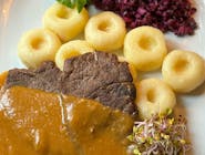 Traditional beef cutlets in their own sauce, Silesian dumplings, red cabbage salad with apple and onion