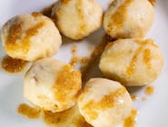 Plum dumplings with butter