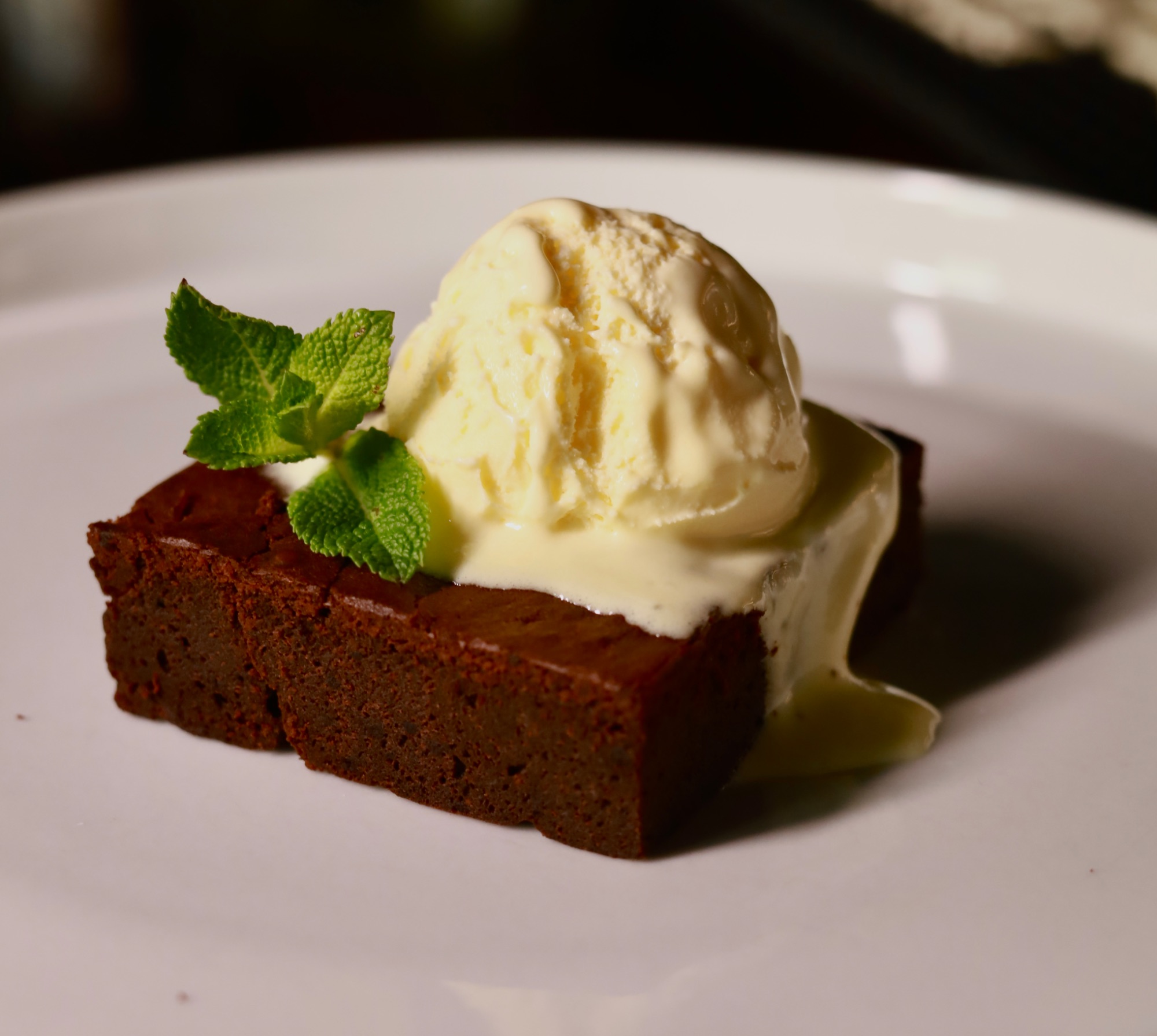 Brownie with a scoop of vanilla ice cream