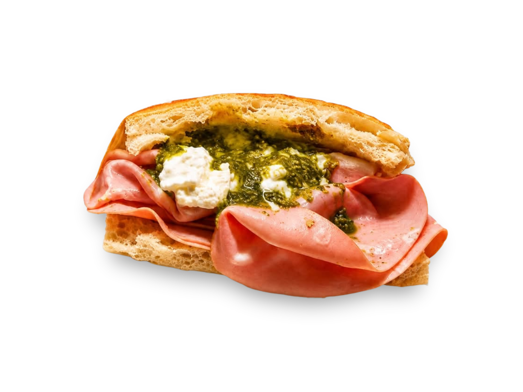 Kanapka z szynką, serem ricotta i pesto na chrupiącej bułce.